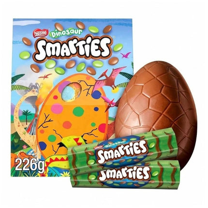 GiaxStore Smarties Dinosaur Giant Easter Egg made of milk chocolate, includes two Smarties Dinosaur tubes.